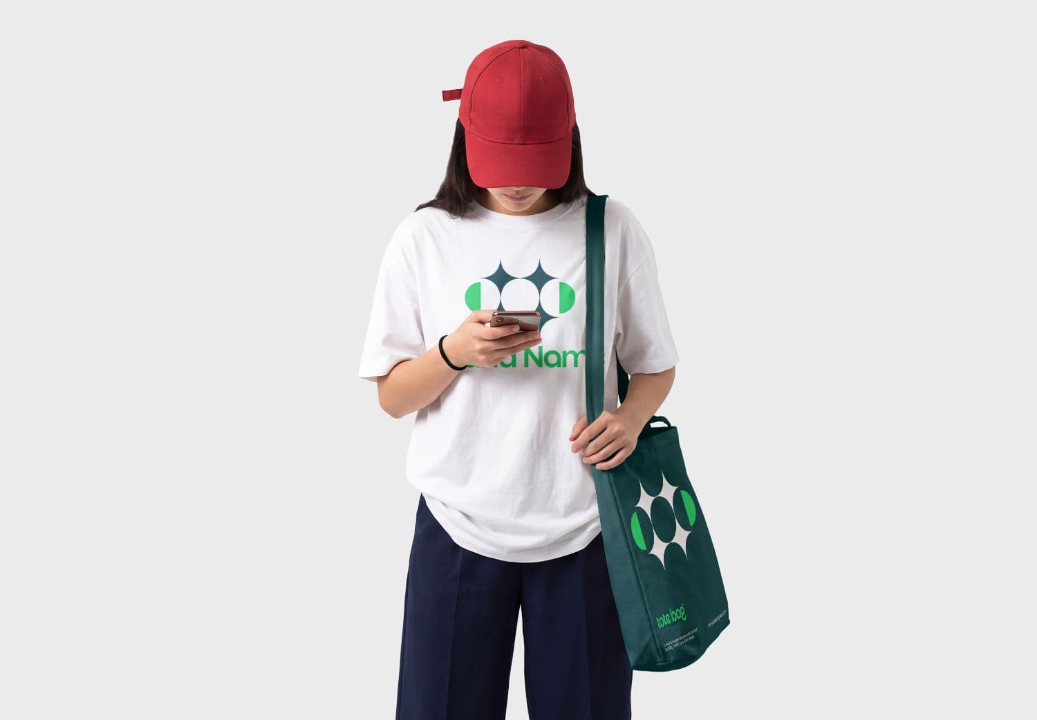 Women's T-Shirt Mockup with Model Wearing a Red Baseball Cap