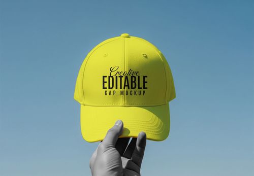 Yellow Cap Mockup Held Against Blue Sky